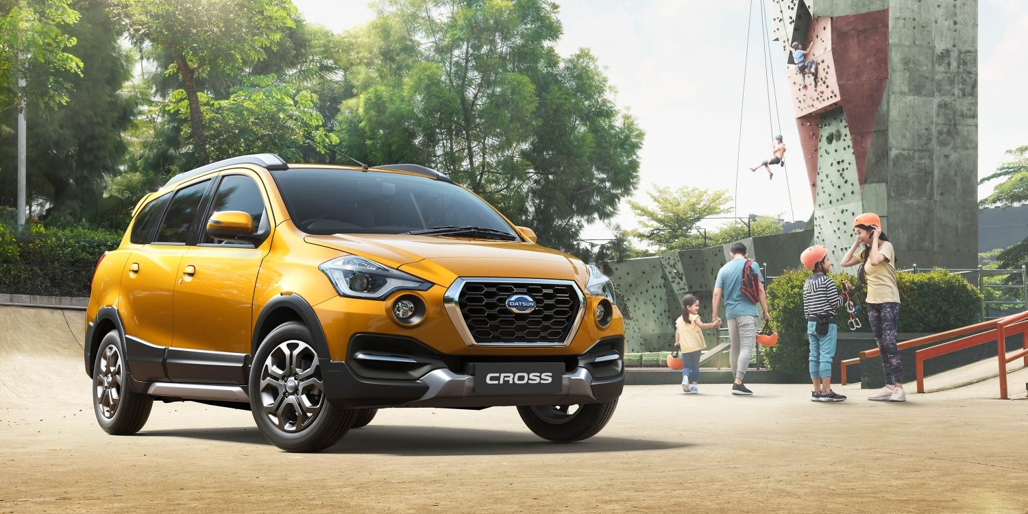 Datsun Cross Parked Near Climbing Wall With Family Close By Datsun Cross Parked Near Climbing Wall With Family Close By